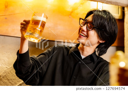 Male drinking beer 127694574