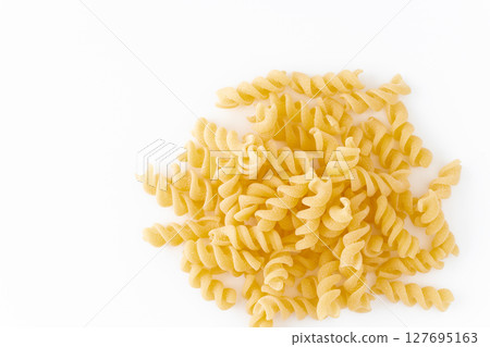 Fusilli (short pasta) on white background Fusilli (short pasta) on white background 127695163