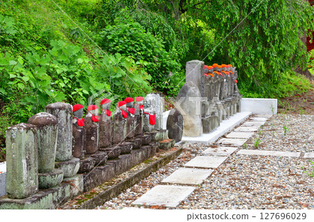Jizo statues lined up along the approach to Ioji Temple, Kitahanda, Kanuma City Jizo statues lined up along the approach to Ioji Temple, Kitahanda, Kanuma City 127696029