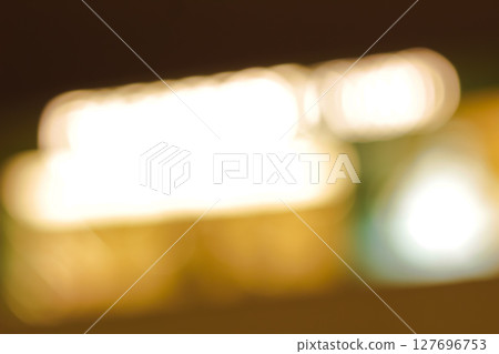 Beautiful bokeh effect with diffused light circles in dark space. 127696753