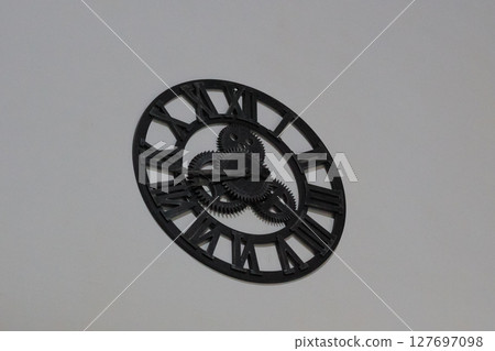 Vintage Industrial Wall Clock with Visible Gears 127697098