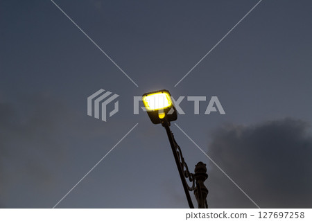 Modern LED Street Light Illuminating Twilight Sky Modern LED Street Light Illuminating Twilight Sky 127697258