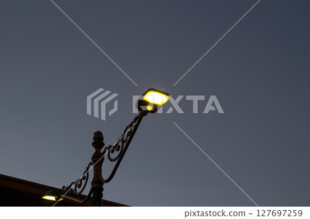 Modern LED Street Light Illuminating Twilight Sky Modern LED Street Light Illuminating Twilight Sky 127697259