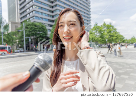 A woman receiving an interview 127697550