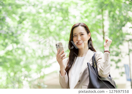 Business woman doing a fist pump 127697558
