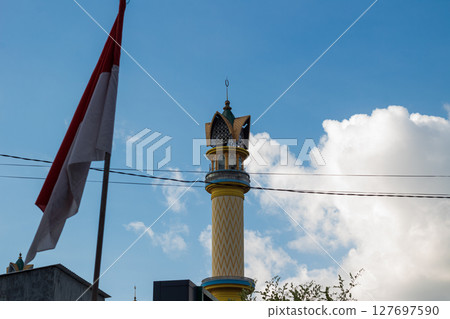 Islamic Architecture: Ornate Minaret with Gold Accents 127697590