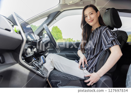 Young woman driving safety drive seat belt Young woman driving safety drive seat belt 127697834