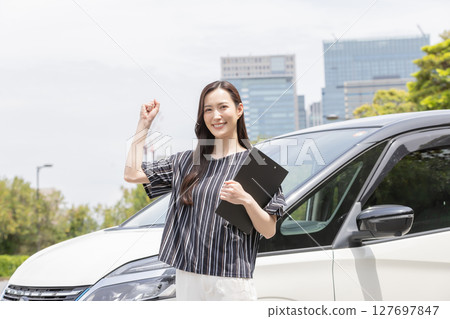 A woman attending a driving school 127697847