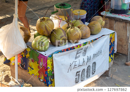 Indonesian Street Refreshment- Fresh Young Coconuts on Display Indonesian Street Refreshment- Fresh Young Coconuts on Display 127697862