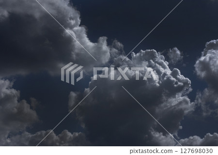 Dramatic dark storm thundercloud rain clouds on black sky background. Dark thunderstorm clouds rainny landscape. Meteorology danger windstorm disaster climate. Dark cloudscape storm disaster gray sky Dramatic dark storm thundercloud rain clouds on black sky background. Dark thunderstorm clouds rainny landscape. Meteorology danger windstorm disaster climate. Dark cloudscape storm disaster gray sky 127698030