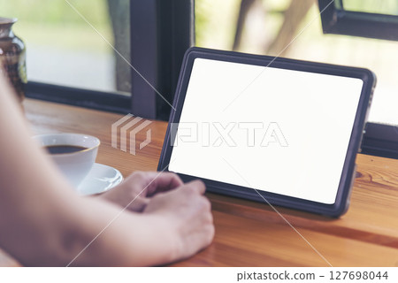Woman hands using smartphone digital technology tablet empty blank screen. Close up Hands women holding smart tablet touch screen shopping online, call. Woman using mock up mobile at home office Woman hands using smartphone digital technology tablet empty blank screen. Close up Hands women holding smart tablet touch screen shopping online, call. Woman using mock up mobile at home office 127698044