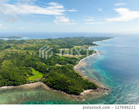 Tropical Island surrounded by turquoise sea water and reefs. Santa Fe, Tablas, Romblon. Philippines. Tropical Island surrounded by turquoise sea water and reefs. Santa Fe, Tablas, Romblon. Philippines. 127698221