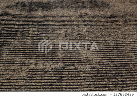 Textured Earth Surface with Horizontal Lines 127698489