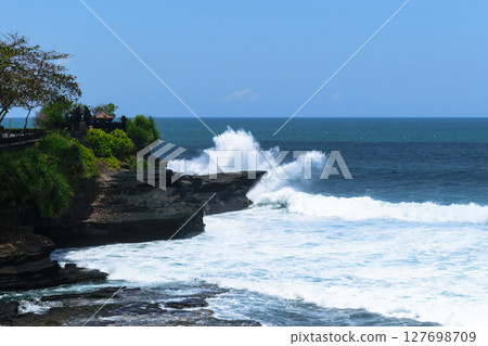 Landscape of huge white Indian ocean wave splash to to the cliff in Bali, Indonesia 127698709