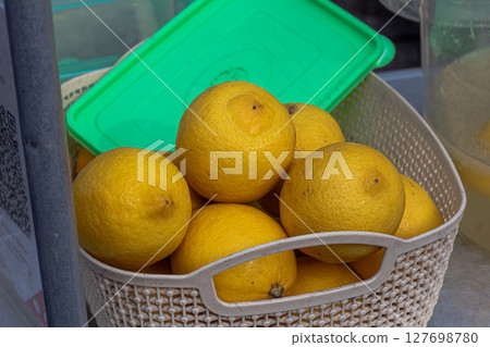 Fresh Lemons in a Basket Ready for Use 127698780