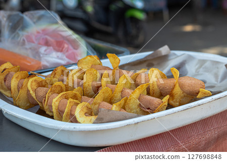 Tornado Potato with Sausage Skewers at Street Food Stall Tornado Potato with Sausage Skewers at Street Food Stall 127698848