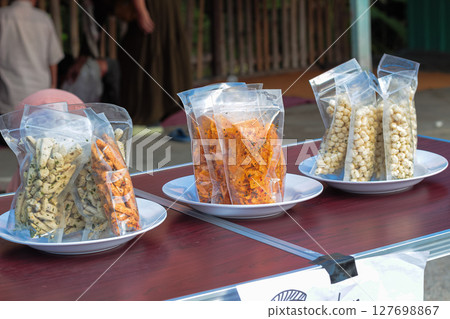 Assorted Packaged Snacks Displayed for Sale 127698867