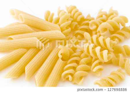 Penne and frigidge (short pasta) on white background 127698886