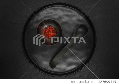 Composition of Saffron in black wooden bowl Composition of Saffron in black wooden bowl 127699115