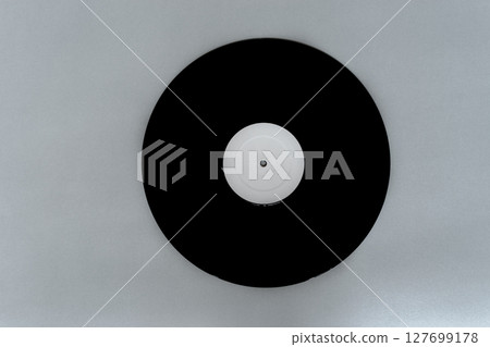 Vinyl LP on Gray Background Surface with Copy Free Space Vinyl LP on Gray Background Surface with Copy Free Space 127699178