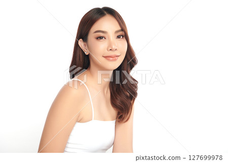A beautiful young Asian woman with clean, fresh skin against a white background. Skincare, facial treatment, cosmetology, beauty, and spa. An elegant portrait of an Asian woman. A beautiful young Asian woman with clean, fresh skin against a white background. Skincare, facial treatment, cosmetology, beauty, and spa. An elegant portrait of an Asian woman. 127699978