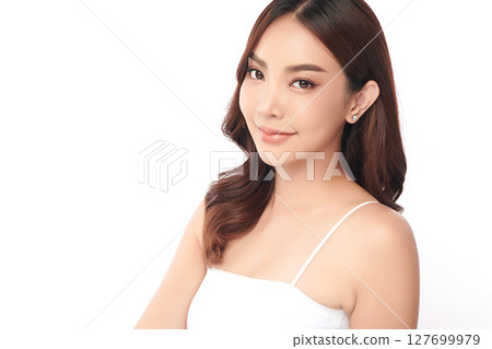 A beautiful young Asian woman with clean, fresh skin against a white background. Skincare, facial treatment, cosmetology, beauty, and spa. An elegant portrait of an Asian woman. A beautiful young Asian woman with clean, fresh skin against a white background. Skincare, facial treatment, cosmetology, beauty, and spa. An elegant portrait of an Asian woman. 127699979