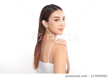 A beautiful young Asian woman with clean, fresh skin against a white background. Skincare, facial treatment, cosmetology, beauty, and spa. An elegant portrait of an Asian woman. A beautiful young Asian woman with clean, fresh skin against a white background. Skincare, facial treatment, cosmetology, beauty, and spa. An elegant portrait of an Asian woman. 127699985