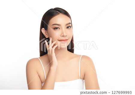 A beautiful young Asian woman with clean, fresh skin against a white background. Skincare, facial treatment, cosmetology, beauty, and spa. An elegant portrait of an Asian woman. A beautiful young Asian woman with clean, fresh skin against a white background. Skincare, facial treatment, cosmetology, beauty, and spa. An elegant portrait of an Asian woman. 127699993