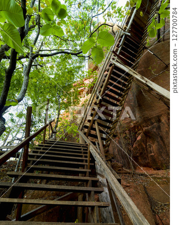 Wooden staircase at Wat Phu Tok in northeastern Thailand 127700784