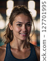 AI-generated image of a woman smiling at the gym 127701995