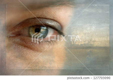 Close-up of a human eye with intricate details and soft textured background showcasing natural beauty 127703090