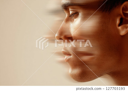 Profile of a young man with motion blur effect conveying speed and dynamic energy in a soft background 127703193