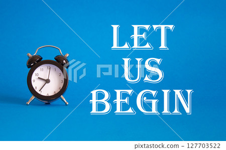Let us begin symbol. Concept word Let us begin on Beautiful blue background with alarm clock. Business and Let us begin concept. Copy space Let us begin symbol. Concept word Let us begin on Beautiful blue background with alarm clock. Business and Let us begin concept. Copy space 127703522