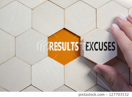 Results or Excuses symbol. Concept word Results or Excuses on wooden comb puzzle. Businessman hand. Beautiful orange background. Business and Results or Excuses concept. Copy space 127703532