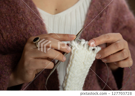 A woman knit with knitting needles,closeup shot 127703728