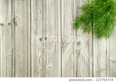 A dill branch in the corner on the table. Proper nutrition. Dietary nutrition 127703734