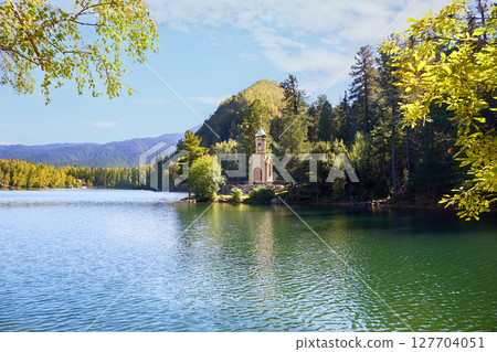 Orthodox Chapel of the Holy Prophet Solomon on the shore of a Emerald Lake among the mountains and forests Orthodox Chapel of the Holy Prophet Solomon on the shore of a Emerald Lake among the mountains and forests 127704051