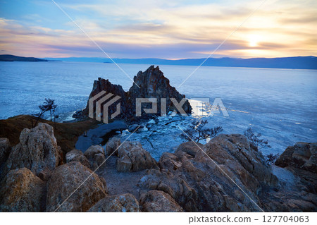 Beautiful view of Cape Burkhan or Shamanka Rock at sunset. Olkhon Island. 127704063