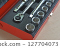Socket wrench in a toolbox 127704073