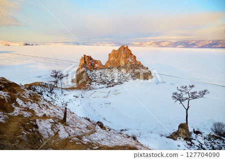 View of Cape Burhan or Shamanka rock on Olkhon island in winter. 127704090