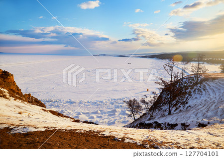 Lake Baikal on a winter morning. Olkhon Island. Sarai Bay, covered with snow 127704101