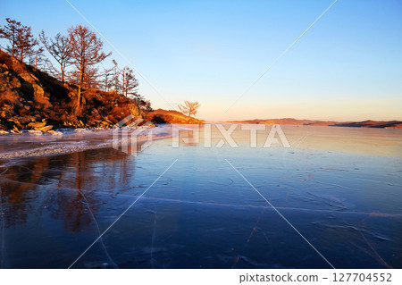 View to the endless expanses of frozen Lake Baikal. Small Sea Strait 127704552