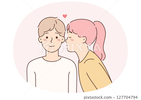 Little girl kisses lover on cheek for concept of first childhood love for boy friend 127704794