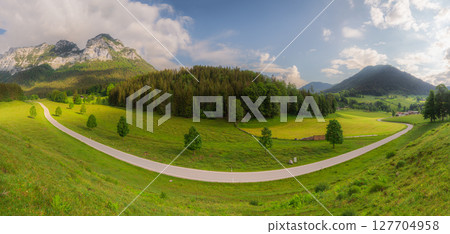 Meadow with road and bench during sunset in Berchtesgaden National Park 127704958
