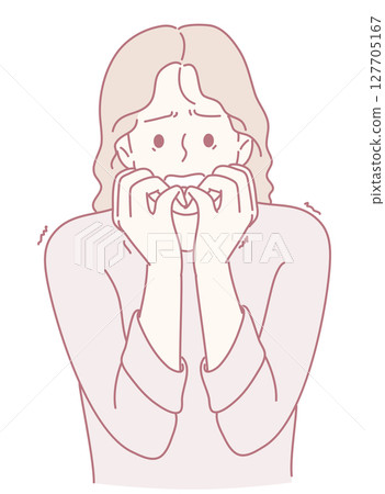 A woman displaying anxiety with a deeply worrying expression on her face and body language A woman displaying anxiety with a deeply worrying expression on her face and body language 127705167