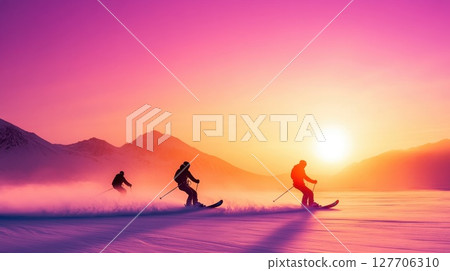 Skiers enjoy a breathtaking sunset on a snowy mountain range with vibrant colors illuminating the winter sky Skiers enjoy a breathtaking sunset on a snowy mountain range with vibrant colors illuminating the winter sky 127706310