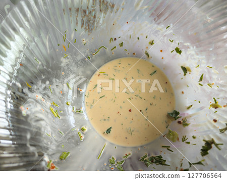 Salad juice leftovers in a glass bowl Salad juice leftovers in a glass bowl 127706564