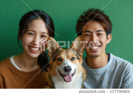 Smiling family and happy time spent with their beloved dog Smiling family and happy time spent with their beloved dog 127706803