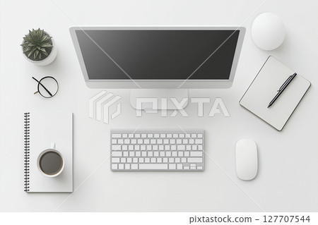 Desktop monitor, white keyboard and coffee cup placed on a white wooden table 127707544