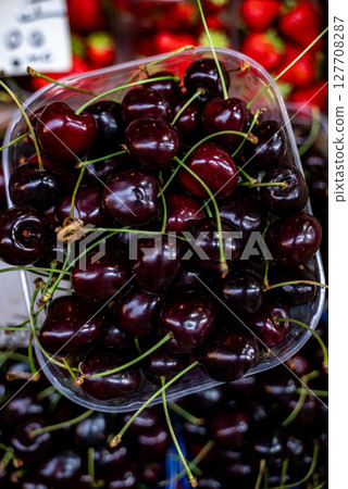 Sweet organic cherries are on the market in Italy. 127708287